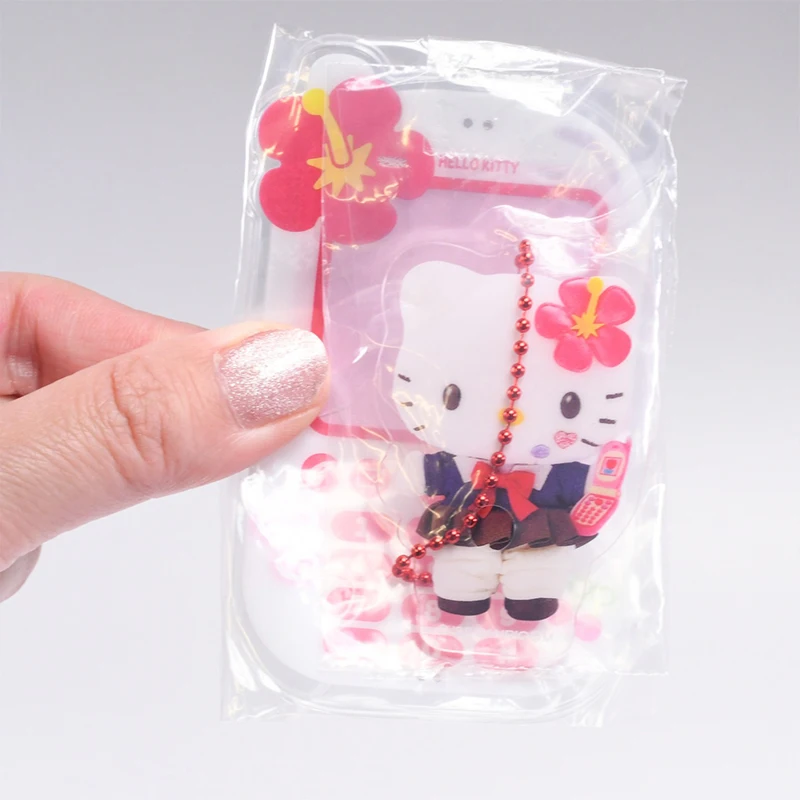 Novo genuíno estilo do telefone móvel pingente acessórios acrílico pingente torcido ovo dos desenhos animados melodia kuromi hellokitty cápsula brinquedos
