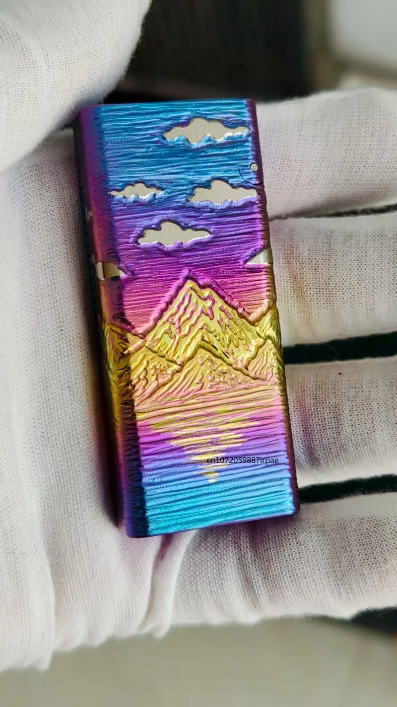 High-end Titanium Alloy Oil Lighter, Mechanical Side Sliding Ignition, Flip Cover Finely Carved Gold Mountain Colored Titanium.