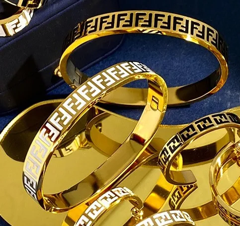 

European and American letter black and white drip oil couple ring fashion earring bracelet set