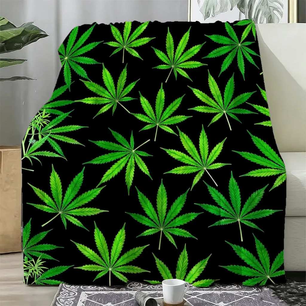 A Black Flannel Blanket with a Green Leaf Array Print. A Modern Printed Style Blanket Featuring a Holiday-limited Design to Warm