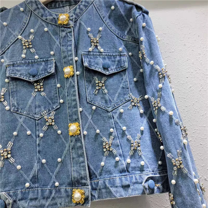 

Quilted denim jacket with pearl & rhinestone details. Cropped, chic design for a timeless, youthful elegance.