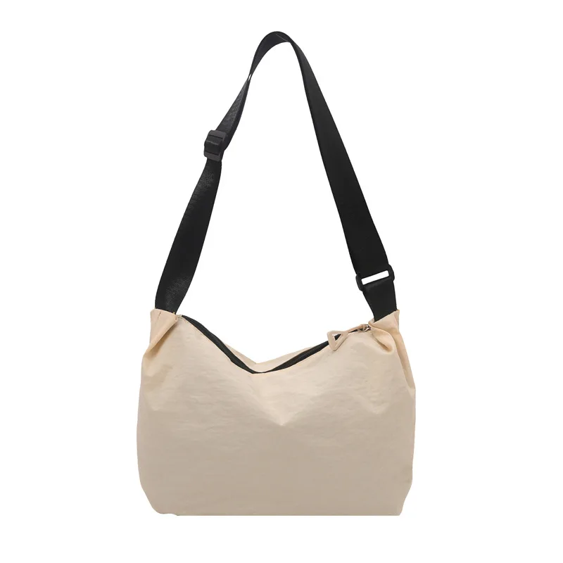 

Fashionable commuting dumpling bags, large capacity canvas bags, and women's casual lightweight multifunctional crossbody bags