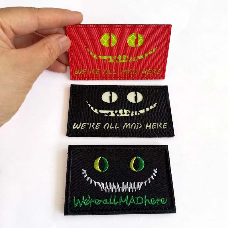 WE'RE ALL MAD HERE Morale Emblem,Cheshire Cat's Eye Glow On the Dark Reflective Patches,Tactical Badges Embroidery Applique