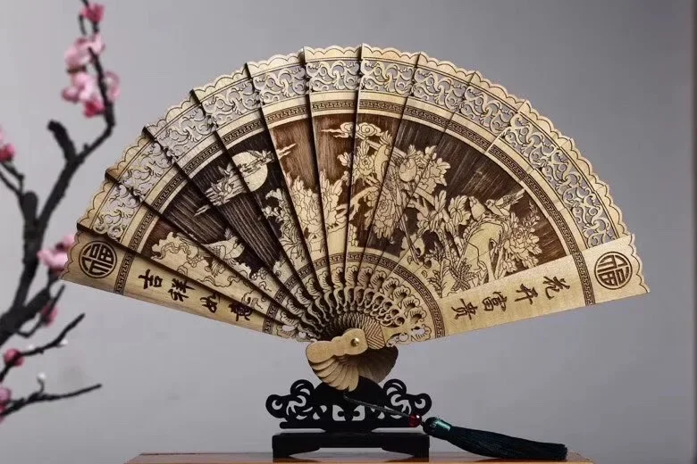 Ancient style folding Chinese style portable fan, golden silk nanmu fan, Su hollow gift fan, carved ornaments