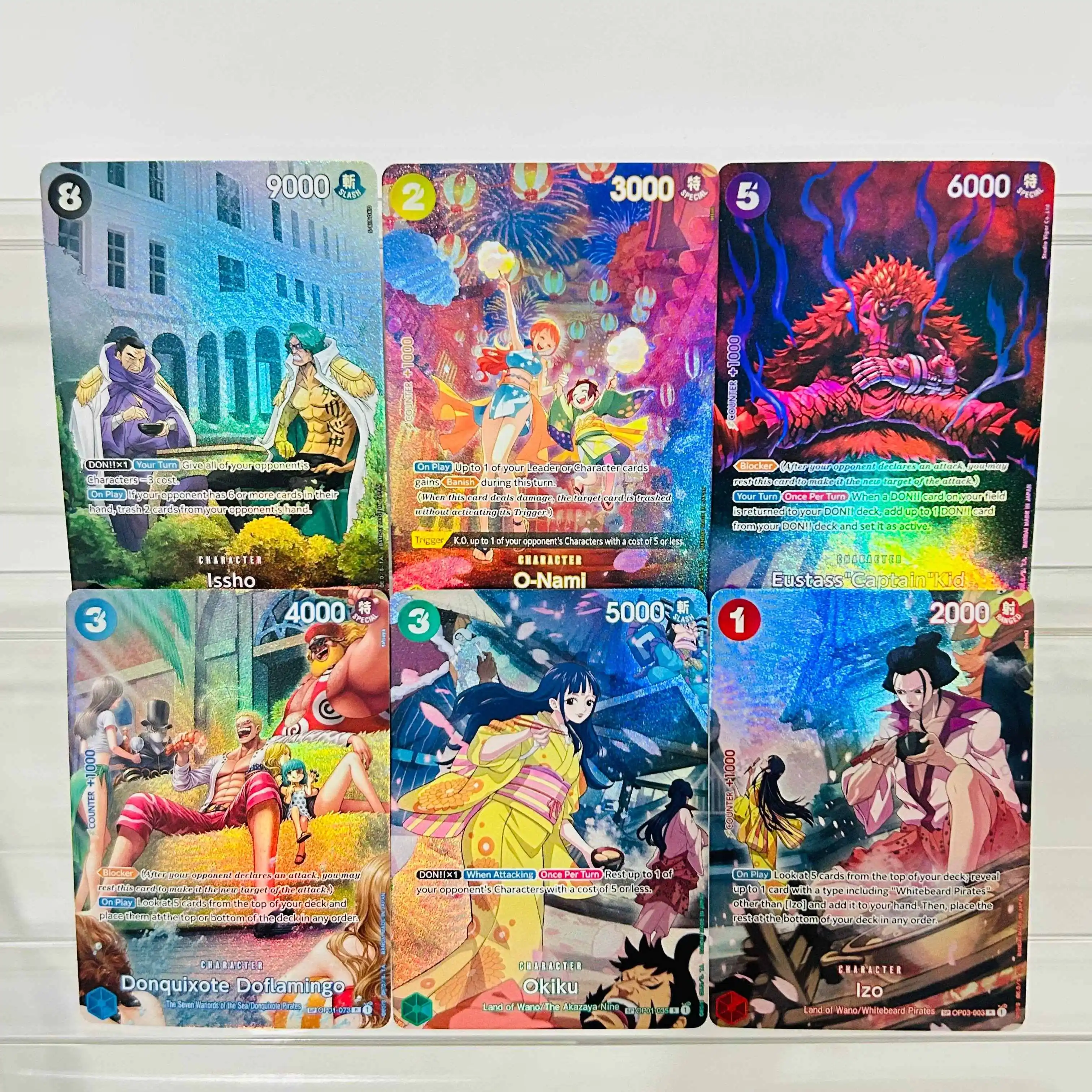 Set de 6 Tarjetas Coleccionables de Anime con Textura Holográfica de One Piece: Issho, O-Nami, Kid, Doflamingo, Okiku e Izo, Perfectas para DIY
