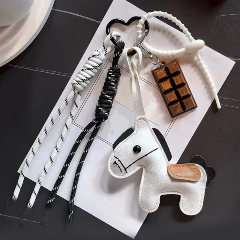 جديد INS نمط الجلود الحصان العام حقيبة الهاتف المحمول حبل معلق الإبداعية الهاتف الحقيبة المفاتيح ملحق من البر الرئيسى للصين
