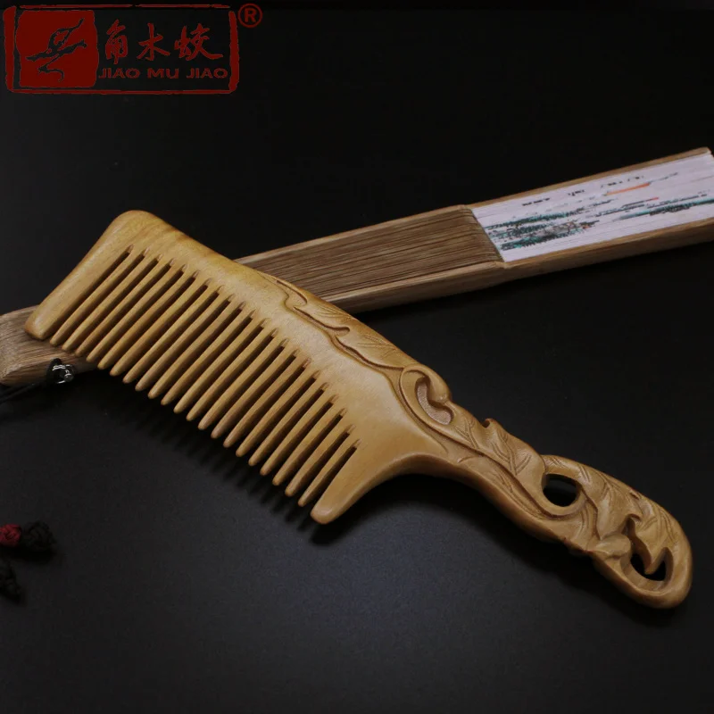 

High-end fine hair comb made from whole green sandalwood with double-sided carved patterns