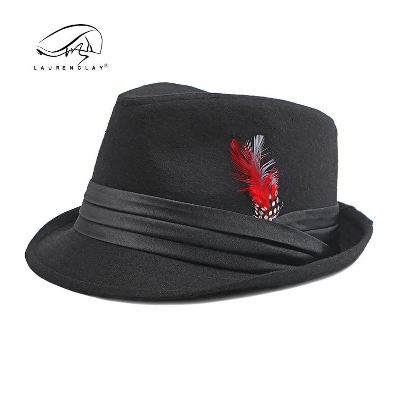 

European and American woolen top hat women's autumn and winter British retro fashion feather performance hat men's jazz hat tide