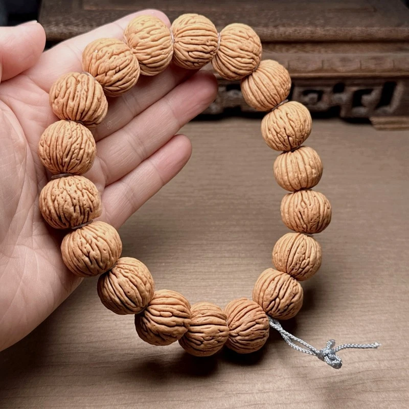 Tree- and vertical-patterned hand-held , round peach stone beads, unisex bracelet, natural product