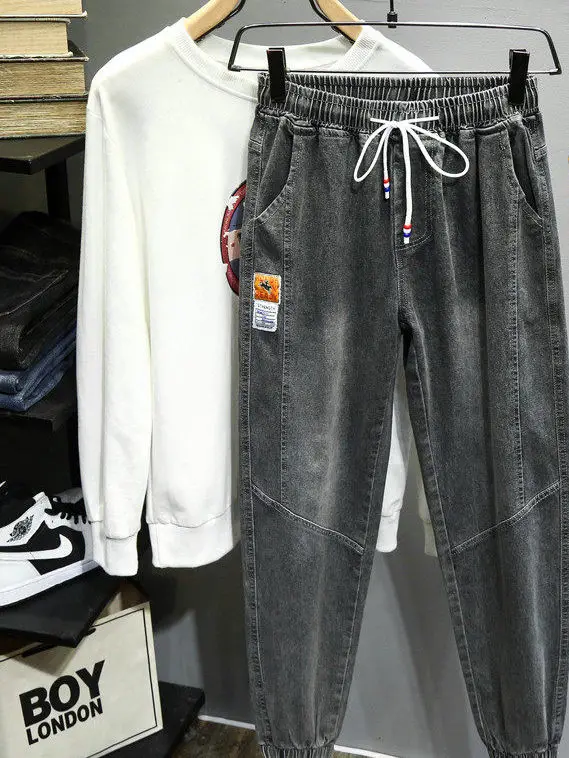 

Недорогие модные мужские джинсы свободного кроя, повседневные длинные брюки, весна-осень, новинка, с завязками на талии, из полиэфирного волокна, износостойкие