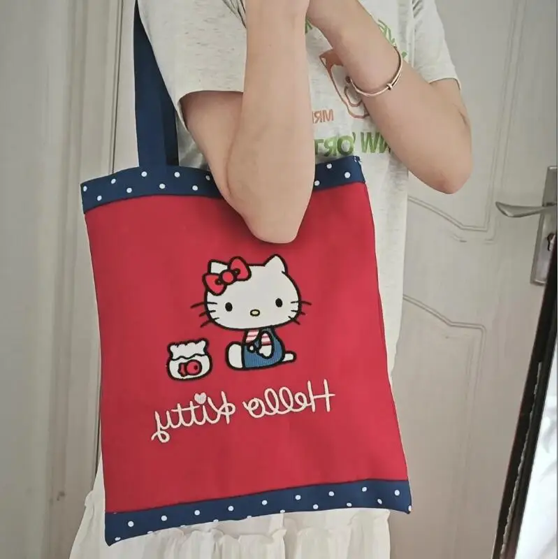 

Популярная холщовая сумка на плечо Sanrio для девочек с героями мультфильмов, студенческий рюкзак Kawaii Hello Kitty, модная простая ручная портативная сумка для хранения