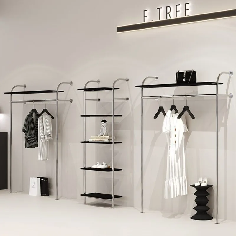 

Women's clothing store, shoes, bags, accessories, black shelves, wall display racks, clothing store, stainless steel