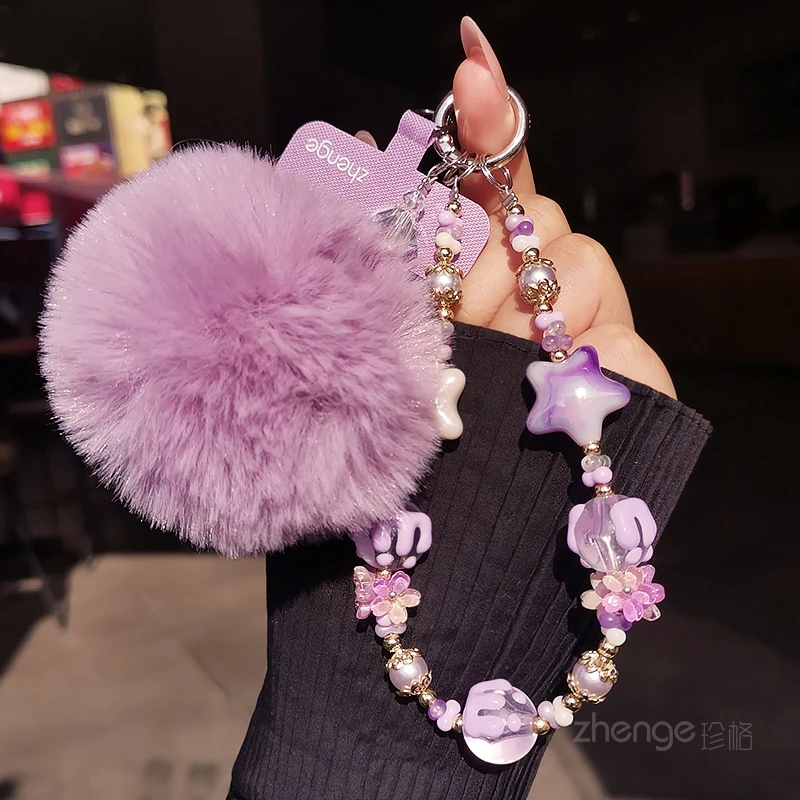 

Women's Outdoor Anti-Loss New Design Phone Chain with Pom Pom, Star, and Flower Accessories Wrist Phone Lanyard