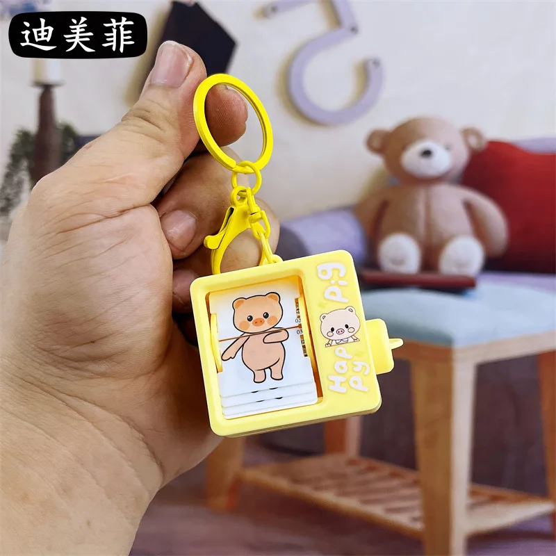 Funny Book Flip Animation Machine Keychain Pendant Creative and Refined Backpack Gift