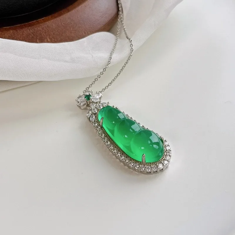 Shiny green chalcedony , translucent and moist a glossy finish, glass body, small pendant with chain, a gift for mom