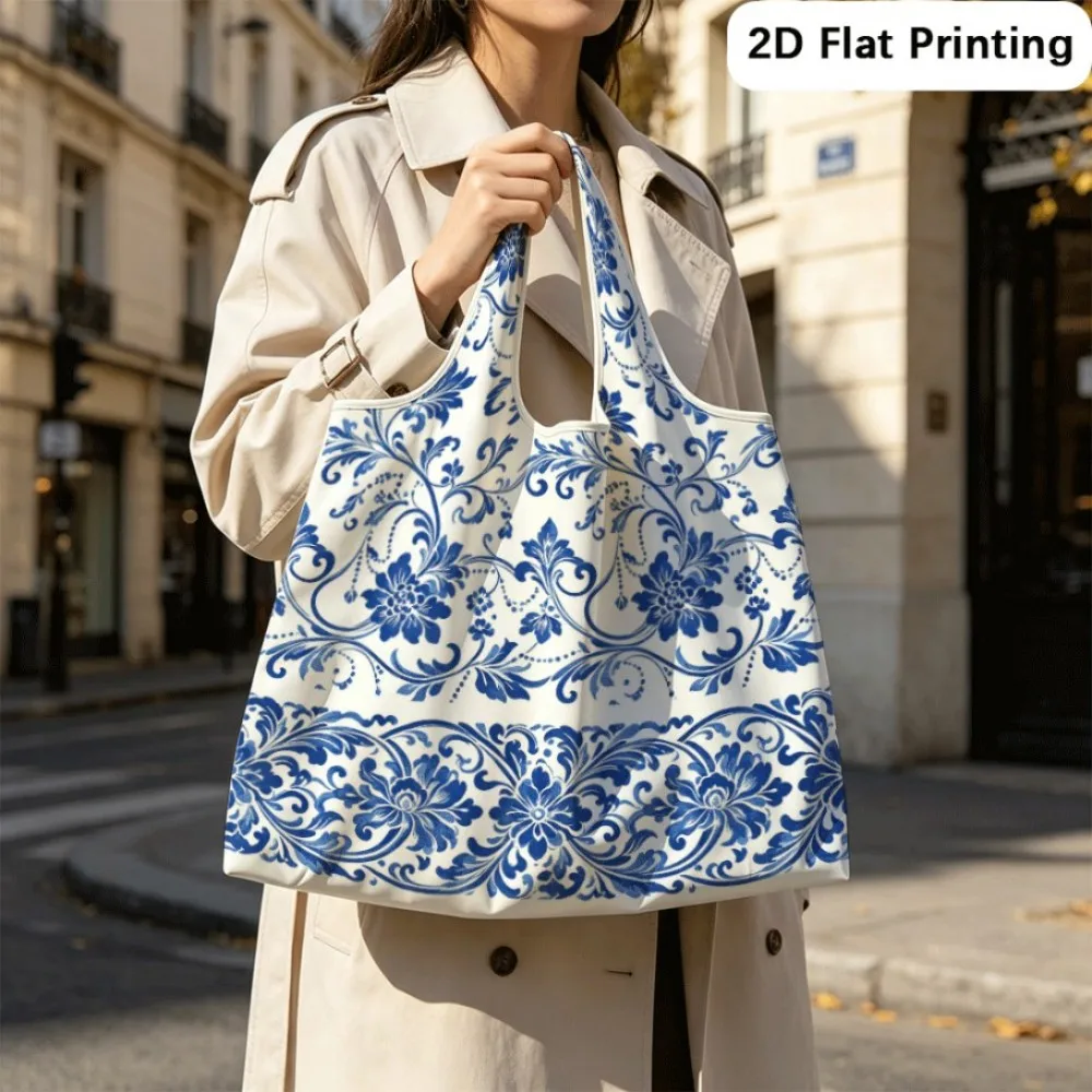 Scrolling vines bear blue blossoms Foldable tote shoulder bag, reliable for frequent outings.