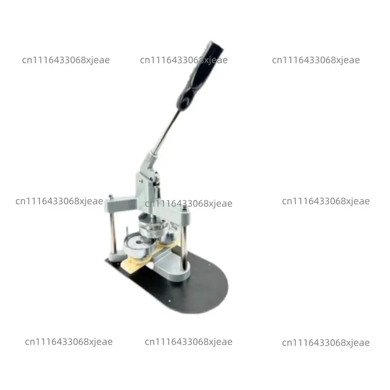 Metal tripod  A machine for making badges