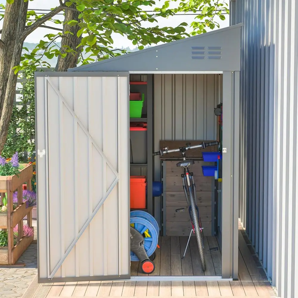 

Металлический навес для хранения на открытом воздухе 4x7 футов с запирающейся дверью, устойчивый к атмосферным воздействиям для использования в саду, патио и газоне серого цвета