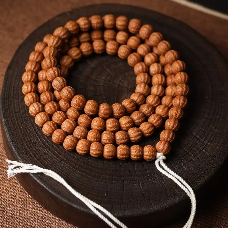 High-quality, meticulously crafted, long-stringed walnut bracelet and necklace with a dense, oily texture, featuring a unique ei