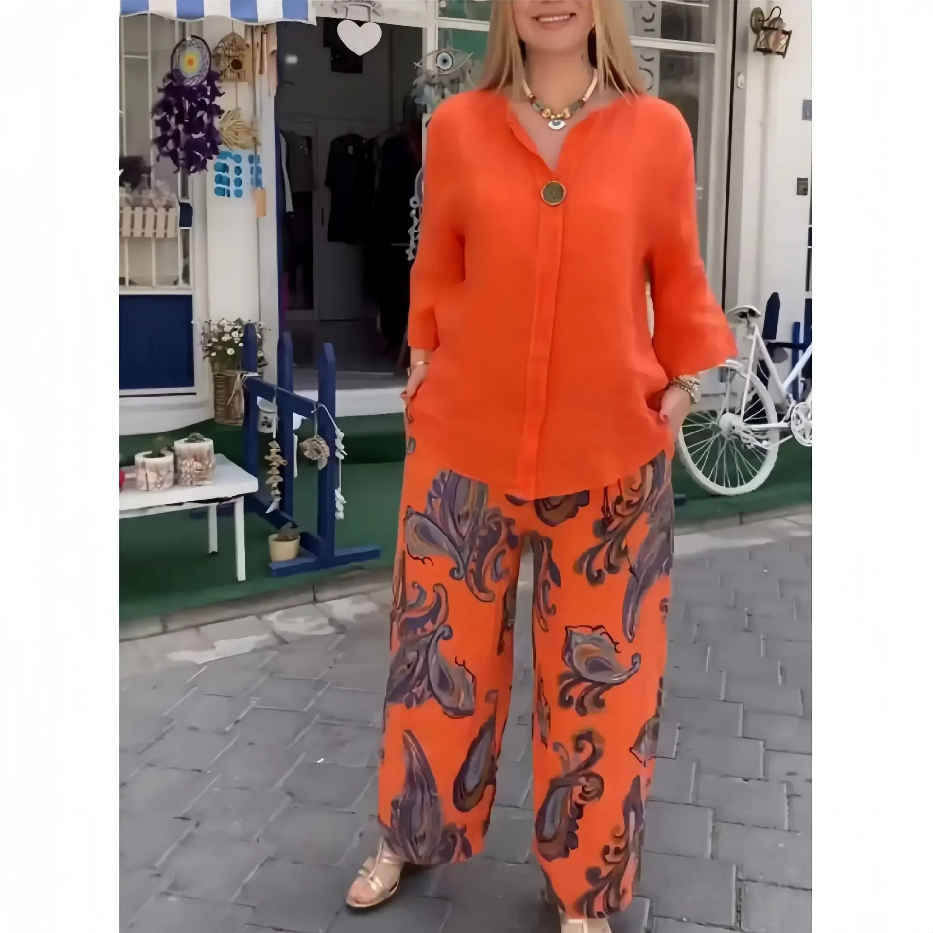 Set di pantaloni da donna in due pezzi Set di pantaloni larghi Casual a maniche lunghe top elegante stampa giuntura pantaloni lunghi a gamba larga elastico in vita autunno