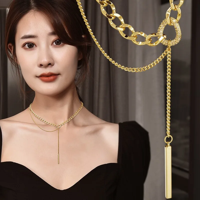 O novo colar de corrente geométrica de aço de titânio é um acessório elegante de borla dupla para roupas femininas