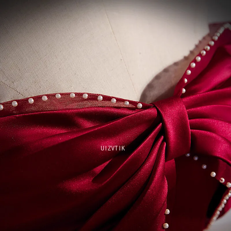 فستان حفلة موسيقية أنيق باللون العنابي للنساء بدون أكتاف بفيونكة كبيرة مناسبة للحفلات المسائية فساتين مناسبة رسمية مخصصة