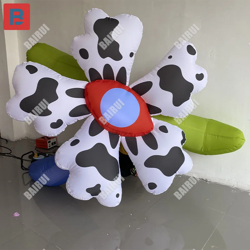 Inflatable cartoon polka dot flower model with a creepy and bizarre theme milk flower hangs as a Halloween stage prop in a mall