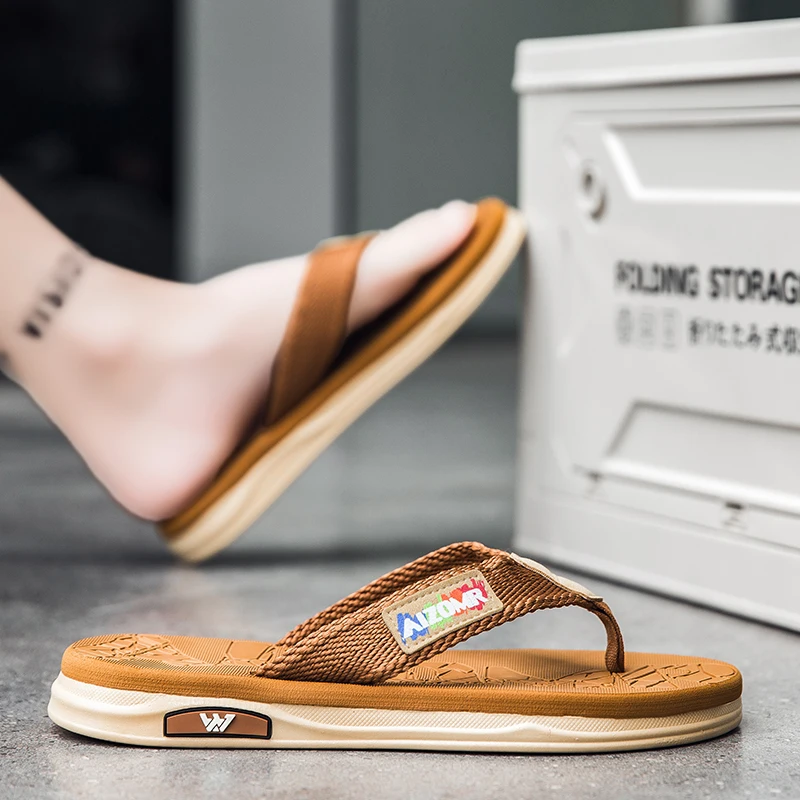 Essential for fashion-conscious men: lightweight, slip-resistant man-made flip-flops for summer, perfect for beach vacations.