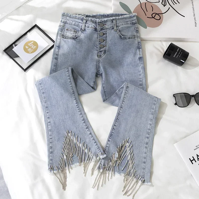 

New golden light wide legged jeans tall waist show thin heavy diamond tassel pants open fork horn