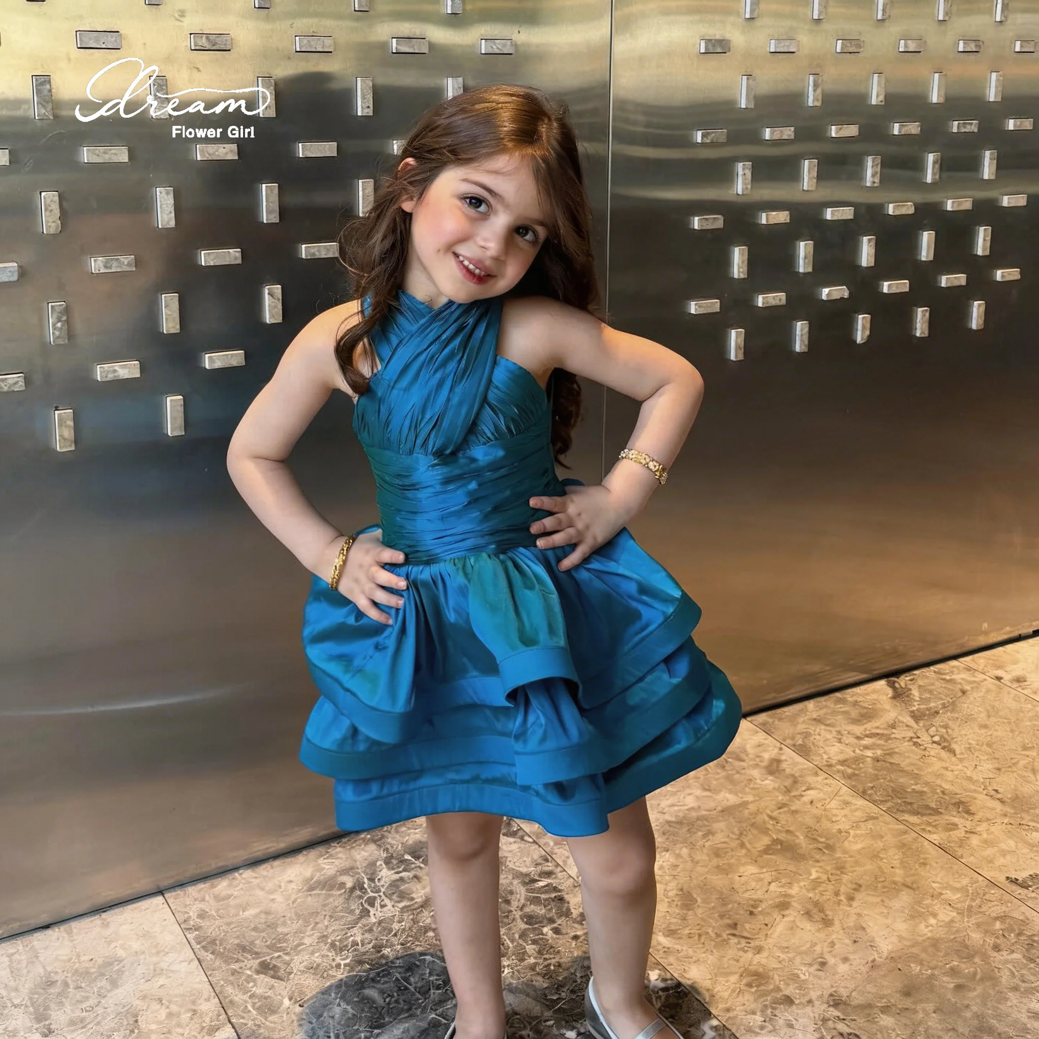 A cute and stylish blue satin halter-neck sleeveless knee-length formal party dress, featuring a layered lace skirt.