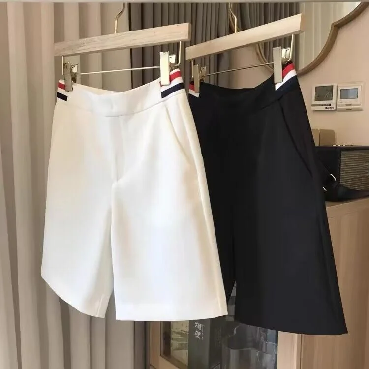 Traje blanco de cinco puntos para mujer, pantalones de pierna recta informales de verano, pantalones de pierna ancha de fibra de poliéster de productos europeos de marca Outlet