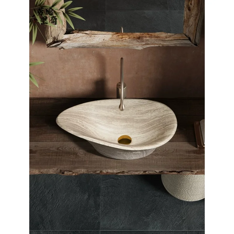 Medieval-style beige and white limestone wash basin in bathroom of guesthouse villa clubhouse hotel
