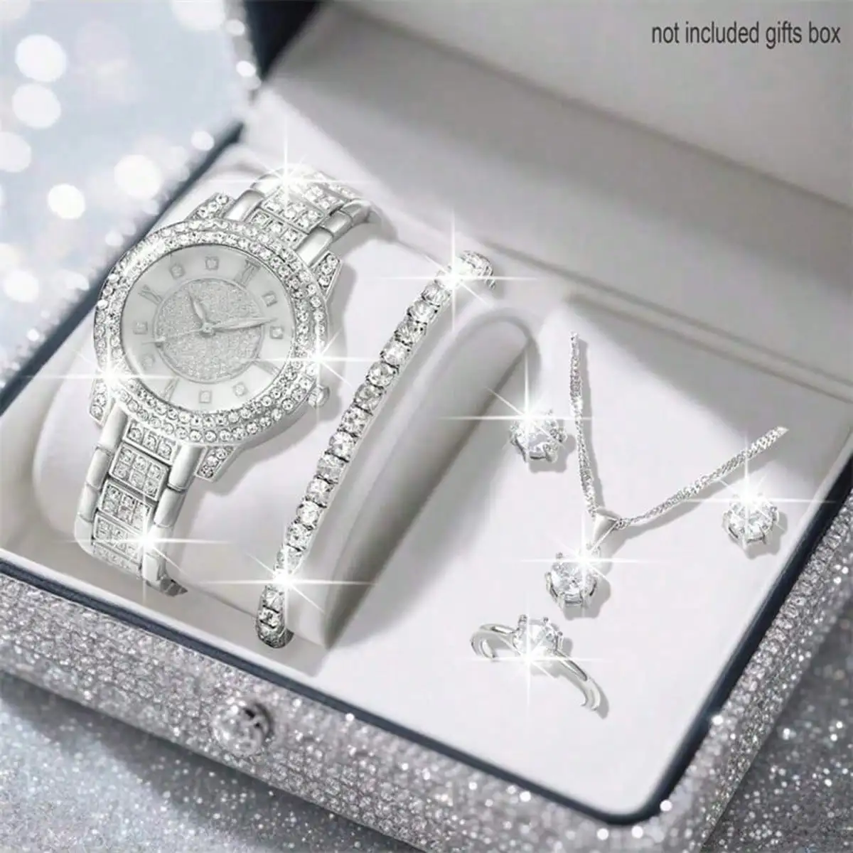 

Набор женских часов и украшений с блестящими стразами - кварцевые часы серебристого цвета с ожерельем, серьгами, кольцом и браслетом.