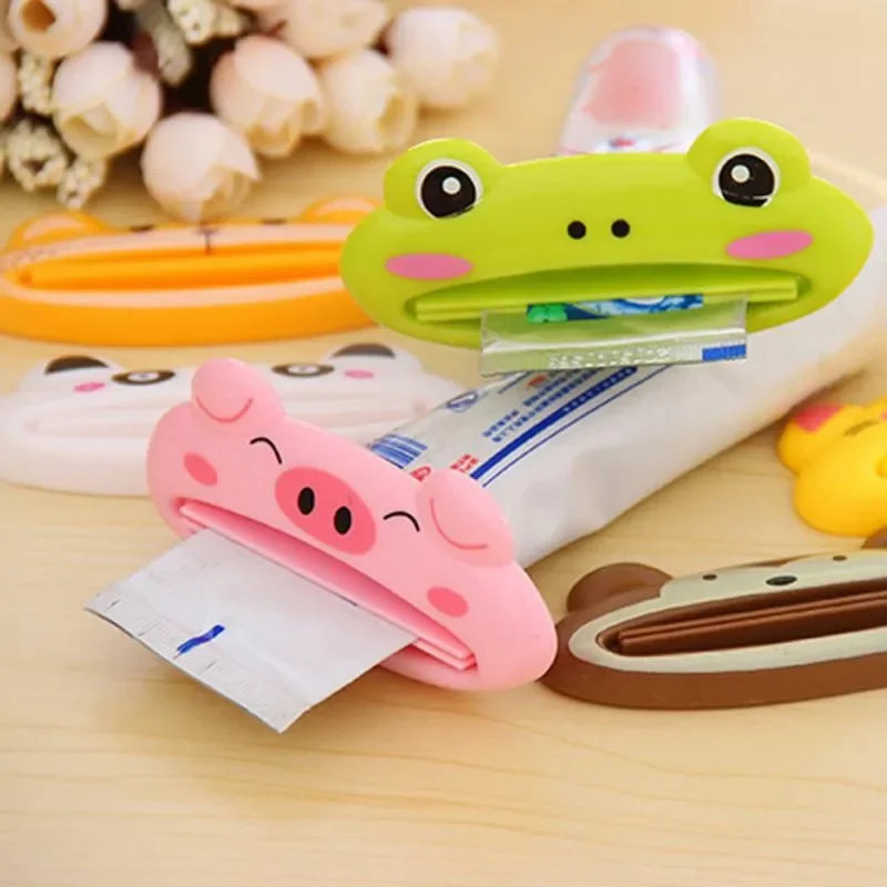 Exprimidor de pasta de dientes con dibujos de animales para niños, 1 piezas, limpiador Facial, Soporte rodante, accesorios de baño