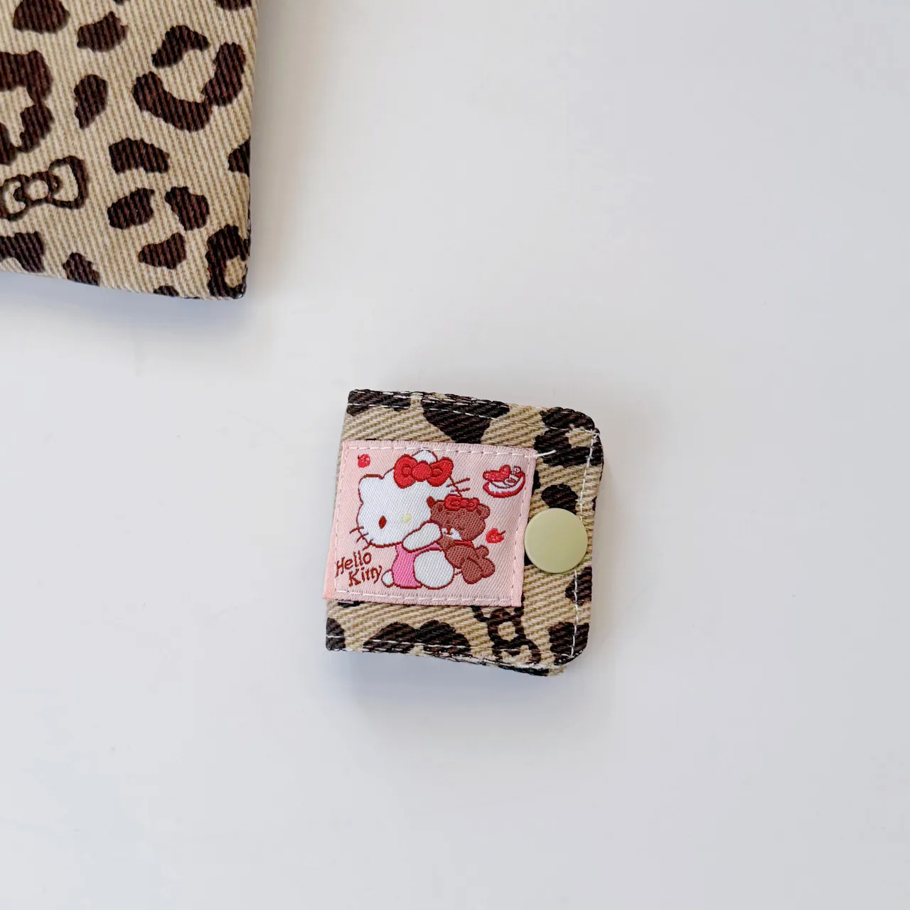 Lindo KT leopardo tela vaquera Cable de datos Clip de almacenamiento hecho a mano Kitty Cable de carga bolsa de almacenamiento cepillo almacenamiento