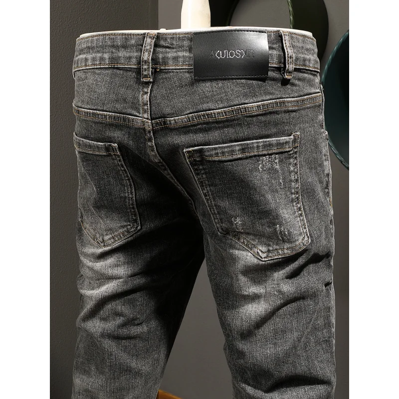 بنطال جينز رجالي عالي الجودة باللون الأسود والرمادي الكوري عصري كاجوال مرن بقصة ضيقة وأرجل صغيرة