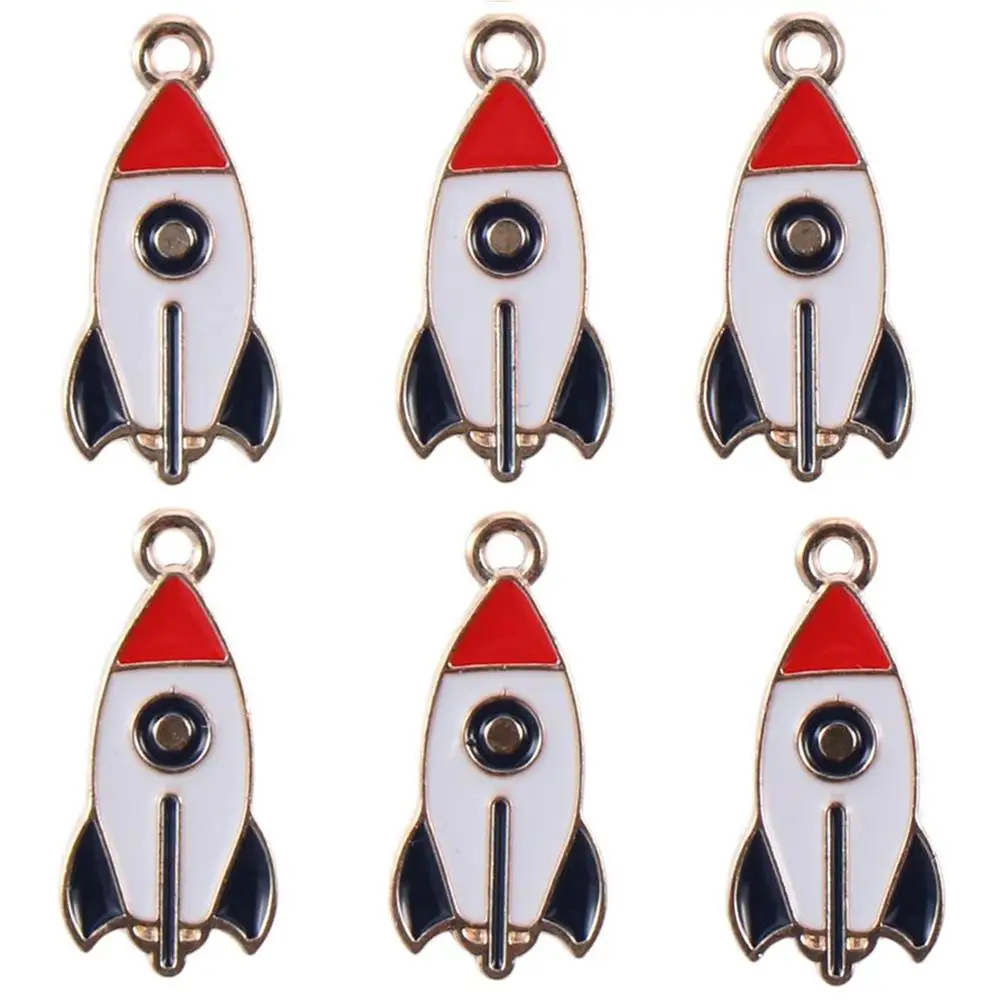 Dijes esmaltados de cohete chapados en oro esmaltado, colgantes esmaltados de aleación de Zinc de 13x27mm, abalorio con tema espacial para fabricación de joyas