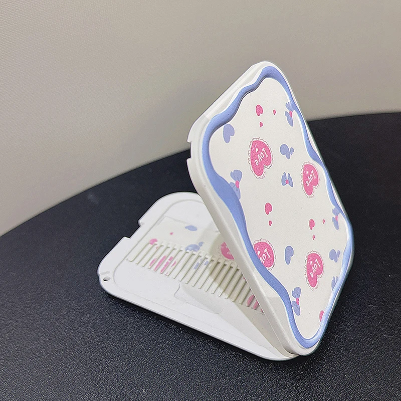 Arco dos desenhos animados amor coração espelho portátil pente conjunto dobrável criatividade estudante dos desenhos animados espelho e pente de cabelo presentes das meninas