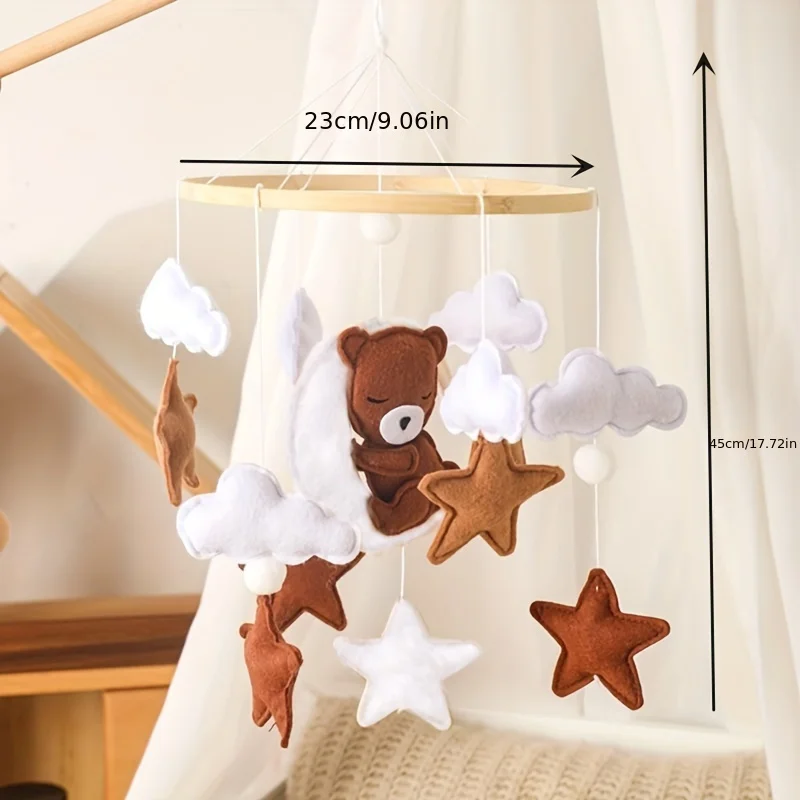 خشخيشات أطفال خشبية، تحمل كرتونية ناعمة من اللباد، نجوم غائمة، أجراس سرير معلقة على شكل قمر، أسرة متنقلة، ألعاب تعليمية