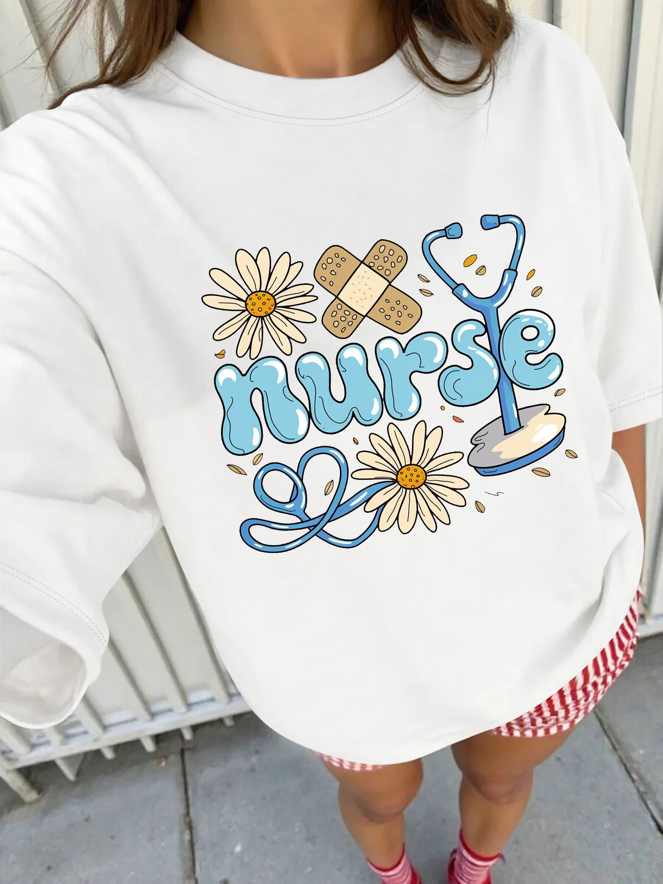 

Plus - Size Short Sleeve T - Shirt: Nurse Theme with Daisy, Bandage & Stethoscope Design, Multi - Color Options