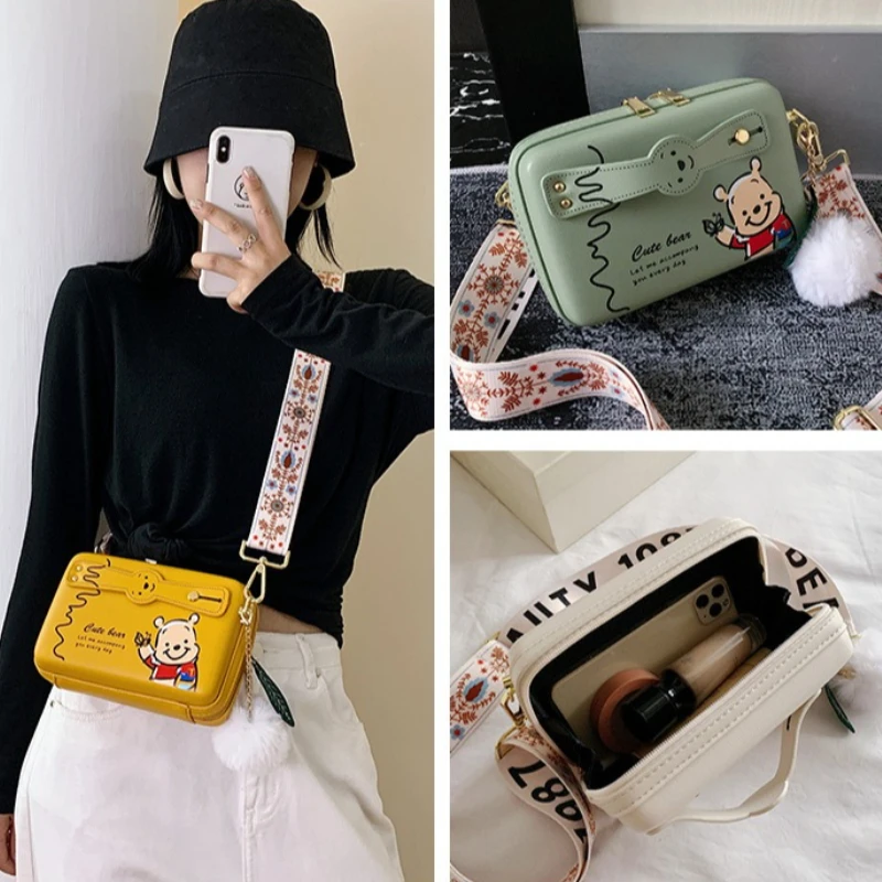 

Cute 2026 New Disney Winnie the Pooh Crossbody Bag for Women Fashionable Shoulder Bag with Fur Ball Pendant Kawaii Daily Handbag