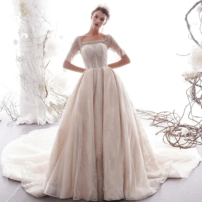

Customized 2025 Champagne Color Square Collar Beaded Pearl Long Train Bell Sleeve Wedding Dress Elegant Floor-Length Gown
