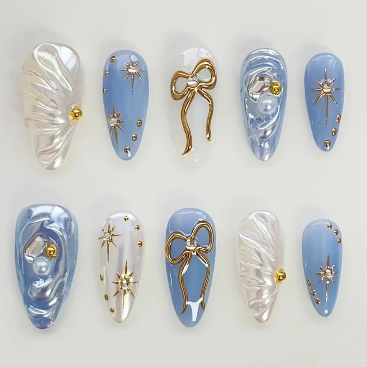 

24Pcs Summer Blue False Nails Set Press on Fashion Almond Bow Star Design Fake Nail with Broken Diamond Wearable Nail Art Tips