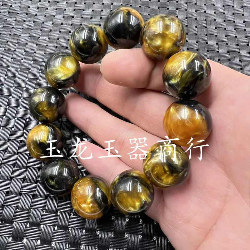Fluorescent gold thread , green honey amber 20mm round bead , unisex bracelet