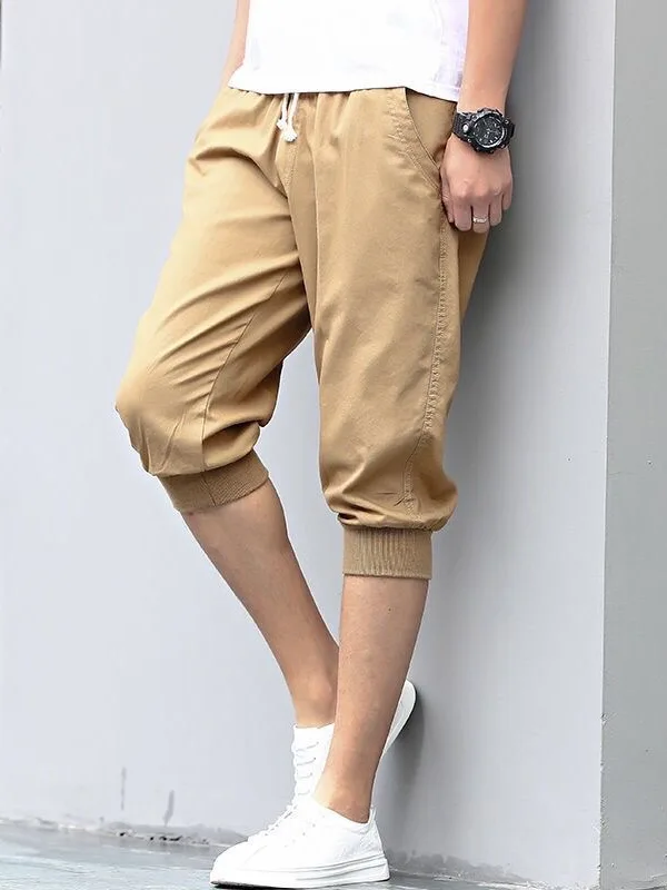 Pantaloni da sette piedi in puro colore giovanile da uomo con risvolto allentato Harem estivo sottile sportivo casual cintura elastica ampia