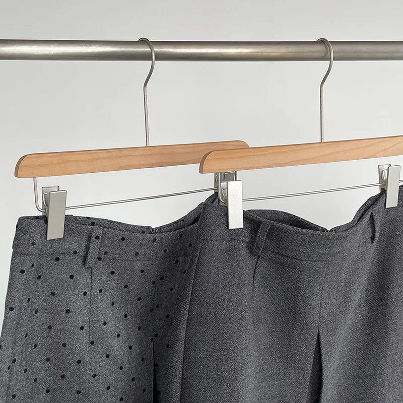 Jesienno-zimowa koreańska spódnica wełniana w stylu retro w grochy, pogrubiona, do połowy łydki, podkreślająca temperament.