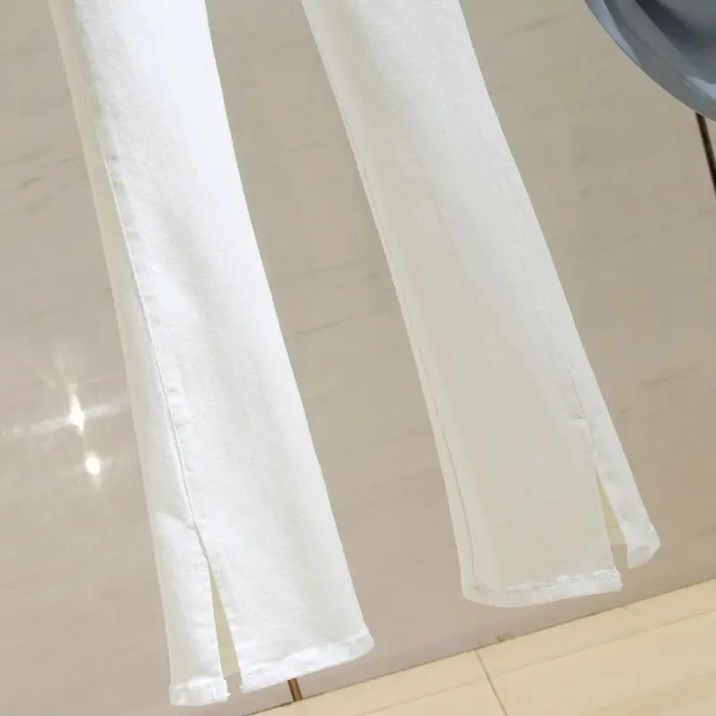 White micro flared jeans women's high waist autumn new Korean version slim fit versatile and elastic split flared pants