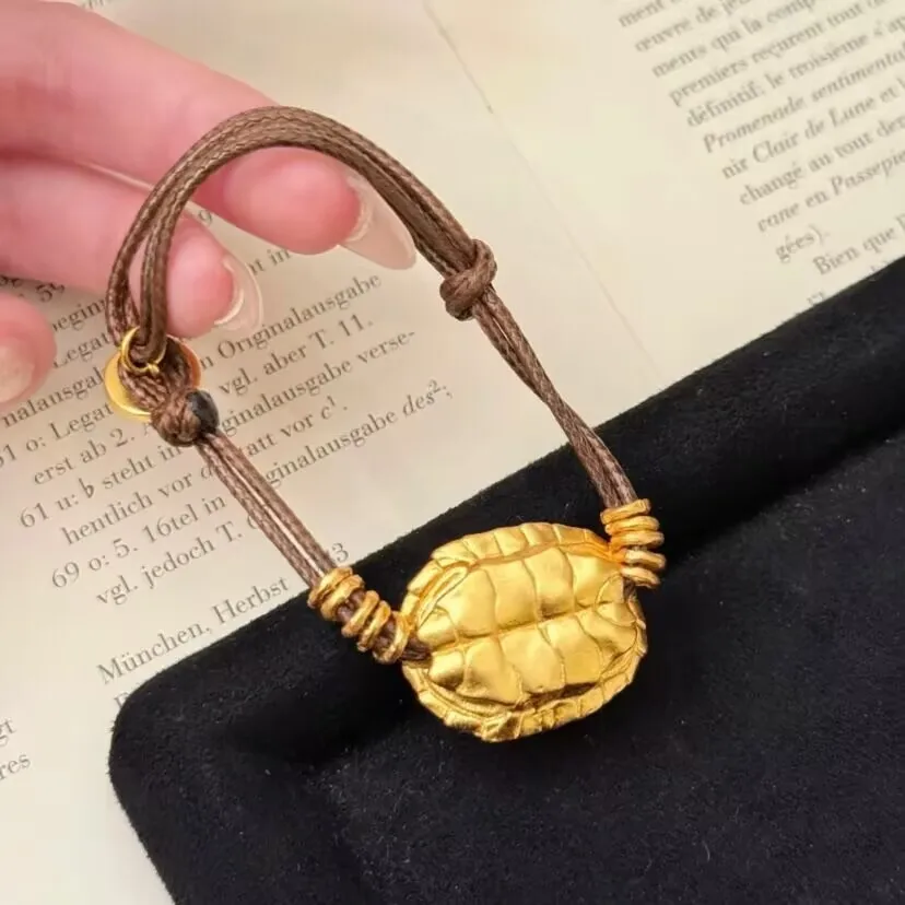 

Plated With Real Gold Strong Preservation Ancient Dharma Sand Golden Wealth God Wrapped In Rich Armor Leather Rope Girls Gift