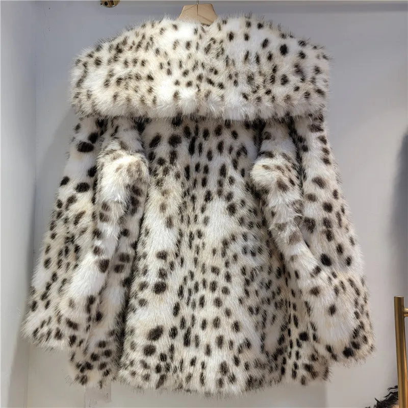

Chic faux leopard fur coat. French coquette style, vegan & midi length. A luxurious winter statement.