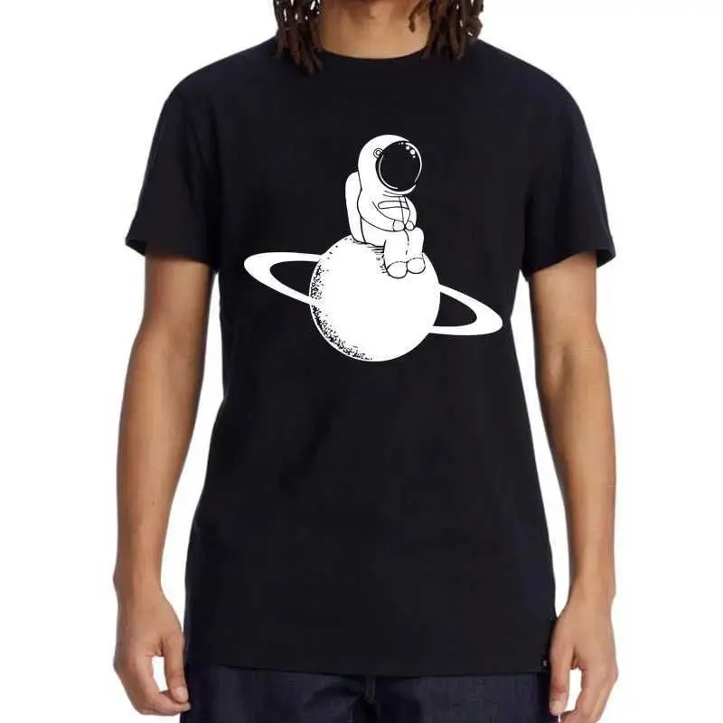 2026 new The astronaut is wearing a Tee with the Saturn logo on the front. It is a casual space-themed piece suitable for both